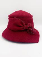 Load image into Gallery viewer, Front view of the lillie &amp; Cohoe grace red/ruby hat. This hat has a pointed brim and a bow  in the front.
